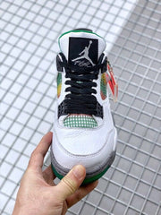 Front view of the sneaker with a black Jumpman tongue label, black laces, and green-and-yellow mesh.