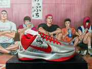 Side view showing the silver upper, red Nike Swoosh, red collar and textured outsole.