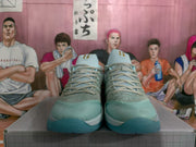 Front view of blue and gray Nike basketball sneakers with lace-up closures and textured toe panels.