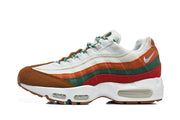 Side view of a Nike Air Max 95 TT sneaker showing its multicolor layered upper and visible Air midsole units.