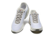 Top view of the pair of white and grey lace-up Nike Air Max DN sneakers.