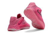 Pink Nike Giannis Immortality 7 shoes showing heel and outsole details