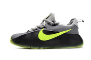 Smoke grey and black sneaker with a neon yellow-green side mark.