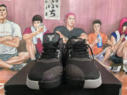 Front view showing the black laces, patterned toe panels, and basketball-player emblems on the tongues.