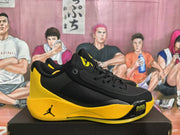 Side view showing the black mesh upper, yellow midsole, Jordan side logo, and visible AIR ZOOM lettering.