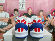 Rear view of the sneakers showing blue heel panels, red-and-white heel detailing, and white midsoles.