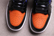 Close-up of the orange perforated toe boxes, black overlays, and black laces.