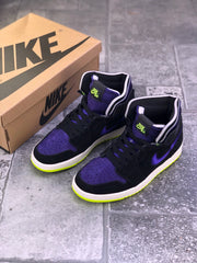 Pair of black and purple high-top sneakers shown with a Nike-branded box.