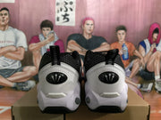 Rear view showing the white heel panels, black collars, pull tabs, and sculpted soles.