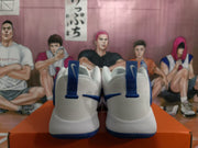 Rear view of the pair showing blue pull tabs, heel panels, and blue outsole edges.