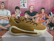 Side profile showing the textured upper, stitched panels, off-white midsole, and translucent amber-colored side section.