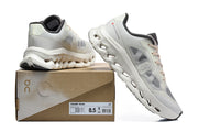 On Cloudtilt Remix sneakers displayed with a shoe box showing sample size 8.5 M.