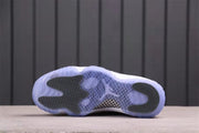 Bottom view showing the translucent blue outsole, black traction inserts, and central patterned section.
