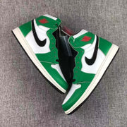 Pair of green, white, and black high-top sneakers arranged on a gray surface.