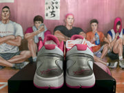 Rear view of the pair showing silver heel panels, pink collars, white midsoles, and Kobe-related heel graphics.