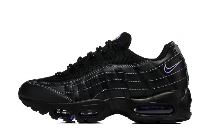 Side view of a black Nike Air Max 95 sneaker with layered panels, contrast stitching, mesh upper, and purple accents.