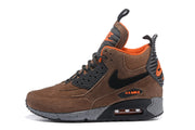 Side profile of a brown Nike Air Max 90 Winter Sneakerboot with black and orange details.