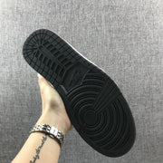 Underside view showing the black rubber outsole with circular traction patterns.