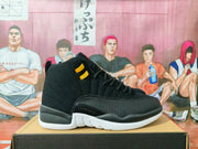 Side view of a black high-top sneaker showing gold collar hardware, textured overlays, and a white outsole.