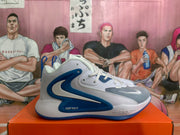 Side profile of a white and blue Nike basketball sneaker with visible Nike branding, “JUST DO IT” detail, and “NIKE ZOOM” marking.