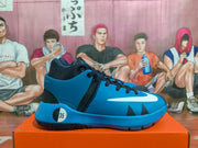 Side view of blue and black Nike KD basketball shoes with a white Swoosh.