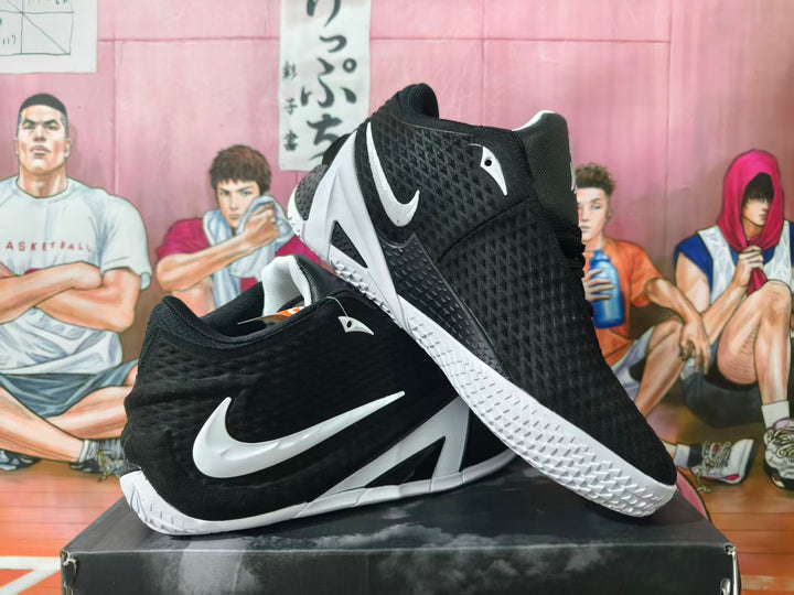 Black and white Nike basketball shoes shown from the side