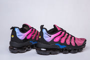Side views of pink, black, and blue Nike sneakers.