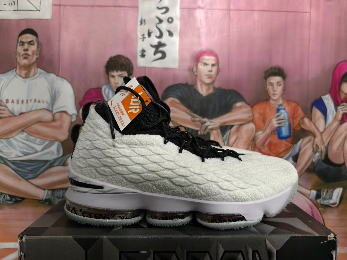 Side view of a white and black high-top Nike basketball sneaker resting on a shoebox.