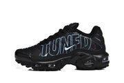 Side view of a black Nike Air Max Plus sneaker with blue outlined lettering and a light blue Swoosh.