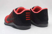 Rear view of red and black Nike Kobe 11 basketball shoes with coral-pink collar lining.