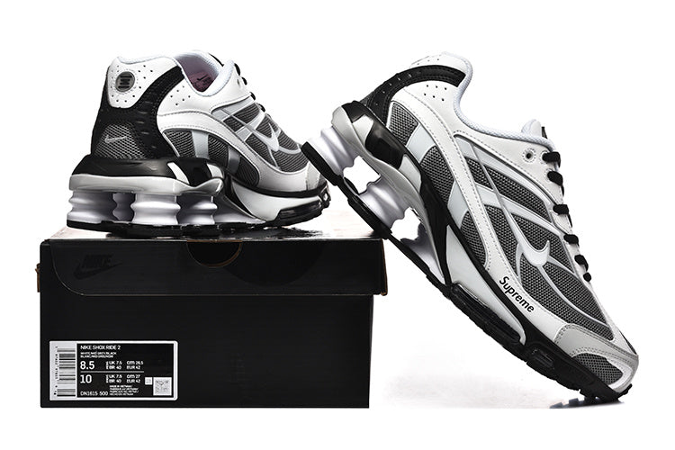 Nike Shox Ride 2 sneakers displayed on a shoe box; the box label reads Nike Shox Ride 2 and shows size 8.5 and style code CN3165 500.