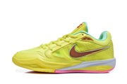 Side view of a yellow basketball shoe with textured panels, mint trim, and a contrasting swoosh-style graphic.