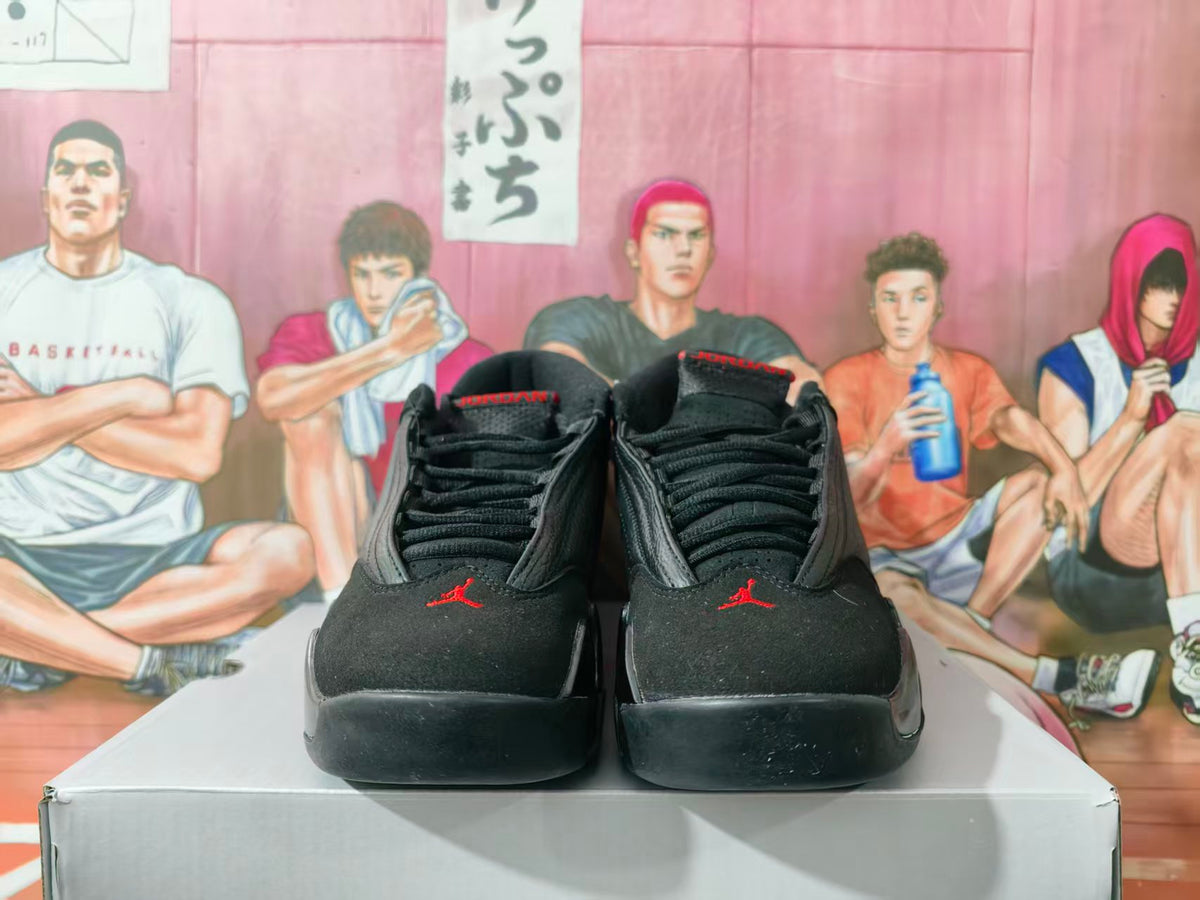 Front view of black and red high-top basketball sneakers displayed on a box.