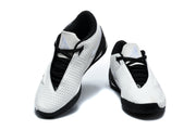 Pair of white and black Nike Kobe basketball shoes, shown from the front.
