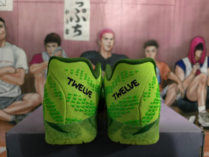 Rear view of fluorescent green Nike sneakers showing patterned heels, dark green collars, translucent green midsoles, and “TWELVE” heel text.
