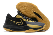 Black and gold basketball shoe with a gum-colored patterned outsole.