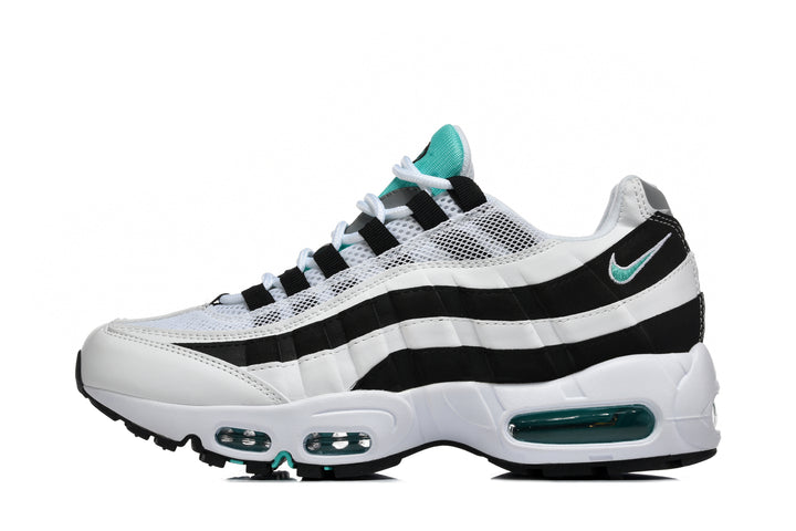 Side view of a black and white Nike sneaker with teal accents, layered wavy panels and visible cushioning windows.