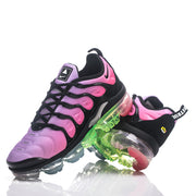 Pink and black Nike TN-21 sneakers arranged in an angled pair view