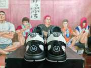 Rear view showing patterned collars and heel graphics reading Kobe and Gigi.