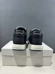 Rear view showing black padded heels with Off-White branding and white midsoles.