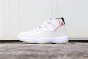 Side profile showing the white upper, red Jordan logo, and sculpted outsole.
