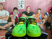 Front view showing the green textured uppers, dark laces, padded tongues, and translucent green outsoles.