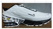Side view of a white sneaker with black accents.