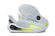 Side and outsole views of the light grey basketball shoes with bright volt details.
