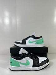Two-view product display showing the low-top sneaker from the side and front.