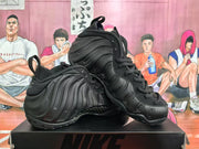 Angled view of two black sneakers displaying the ribbed side panels, high-top construction, laces, and outsole details.