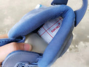 Close-up of the padded collar and interior tongue label of the blue high-top sneaker.