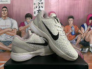 Angled view of the pair highlighting the black Swoosh, padded collar and textured upper.