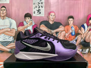 Side view of a black and purple Nike basketball sneaker on a box.