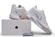 White Nike Sabrina 4 shoes posed above a shoe box